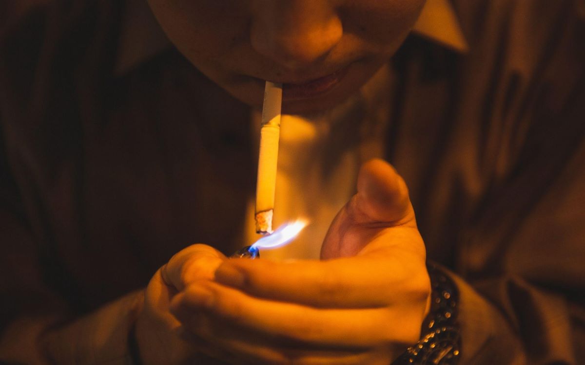 A Man Lighting Cigarette